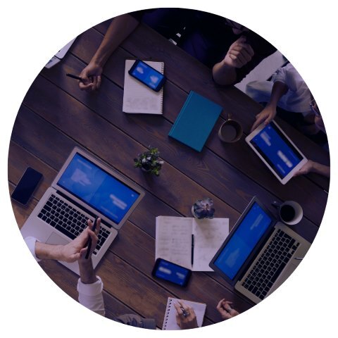 People on devices at table